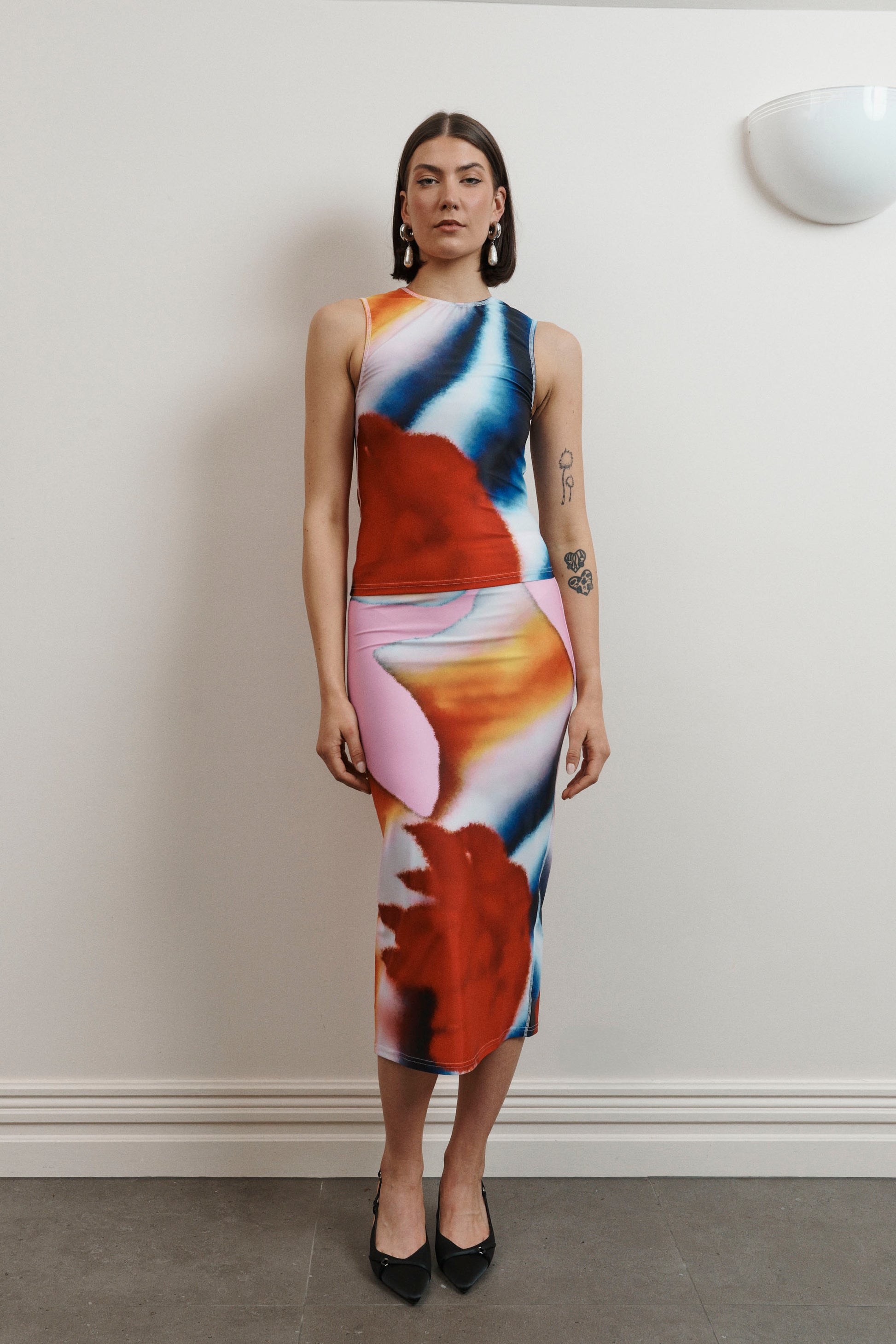 UMA KOURH tritonia skirt calypso multi coloured print red blue pink white abstract midi stretchy fitted skirt