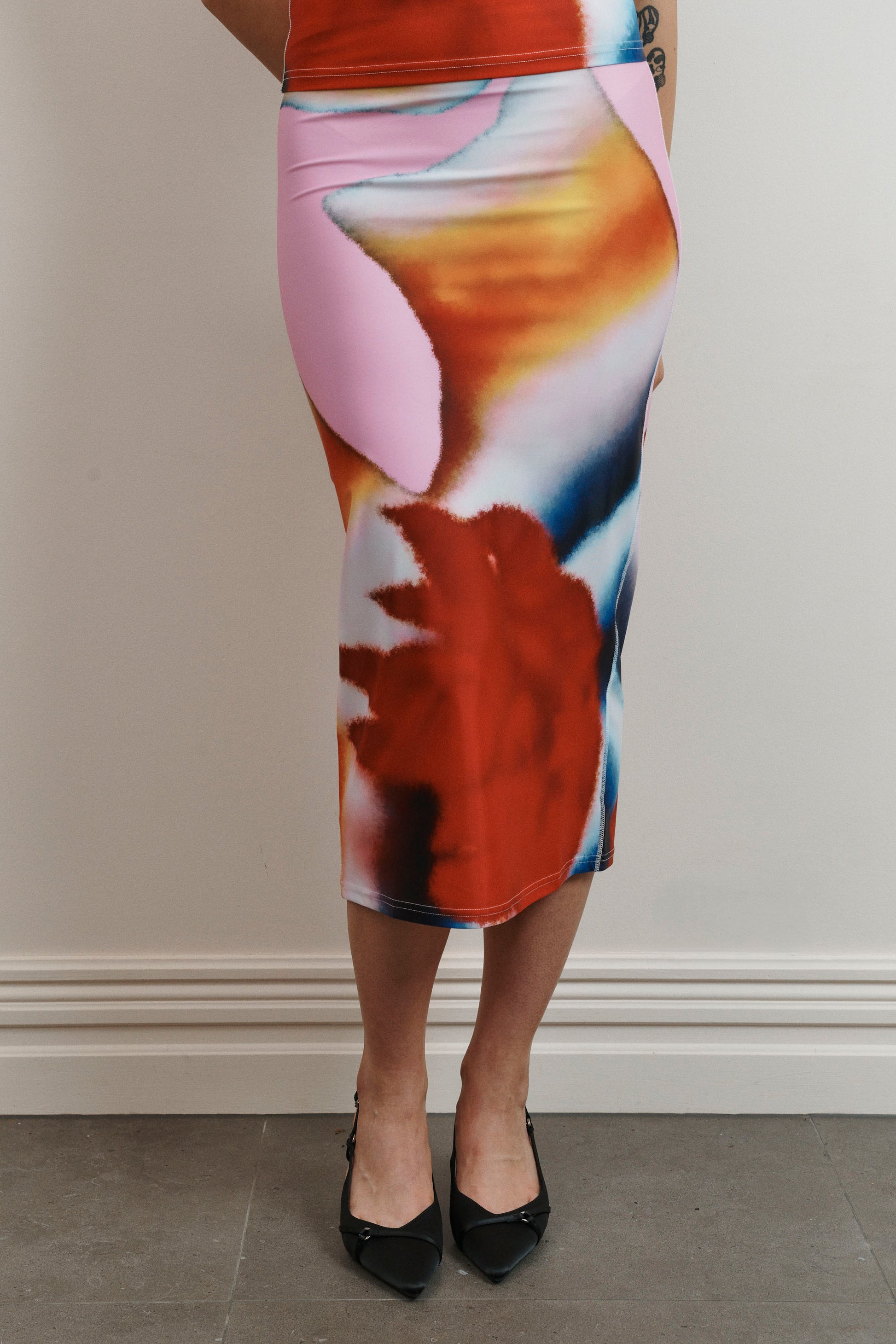 UMA KOURH tritonia skirt calypso multi coloured print red blue pink white abstract midi stretchy fitted skirt