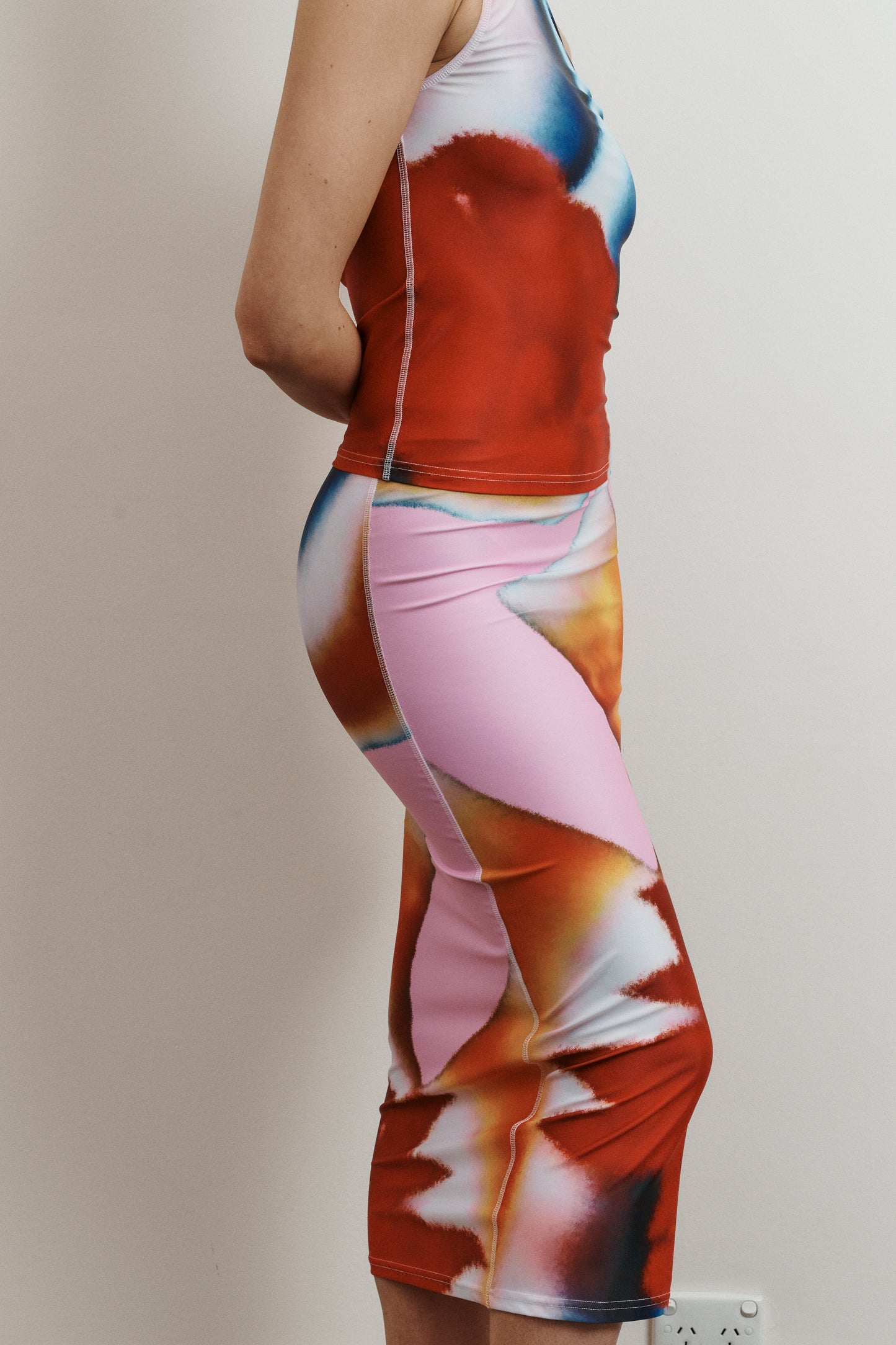 UMA KOURH tritonia skirt calypso multi coloured print red blue pink white abstract midi stretchy fitted skirt