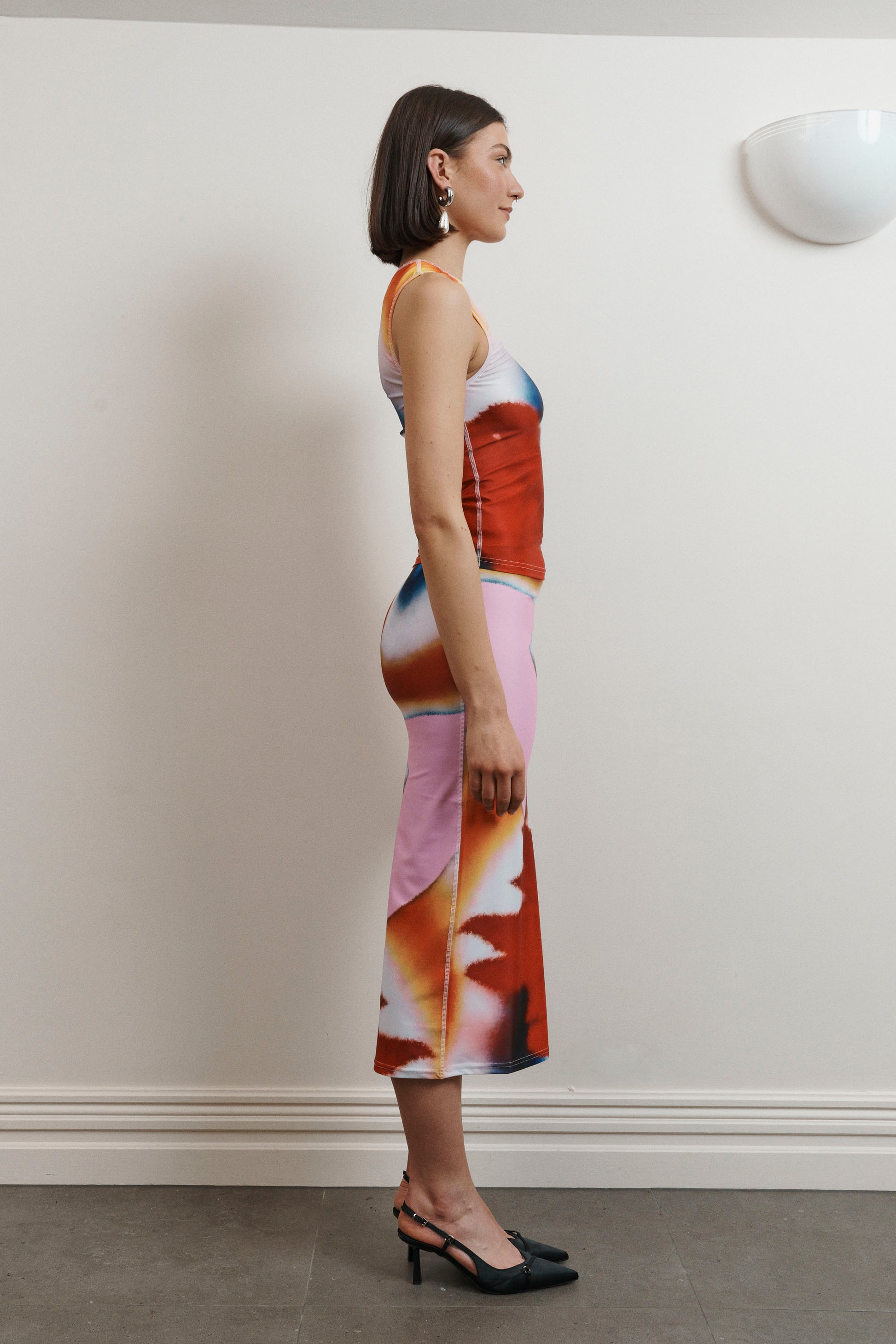 UMA KOURH tritonia skirt calypso multi coloured print red blue pink white abstract midi stretchy fitted skirt