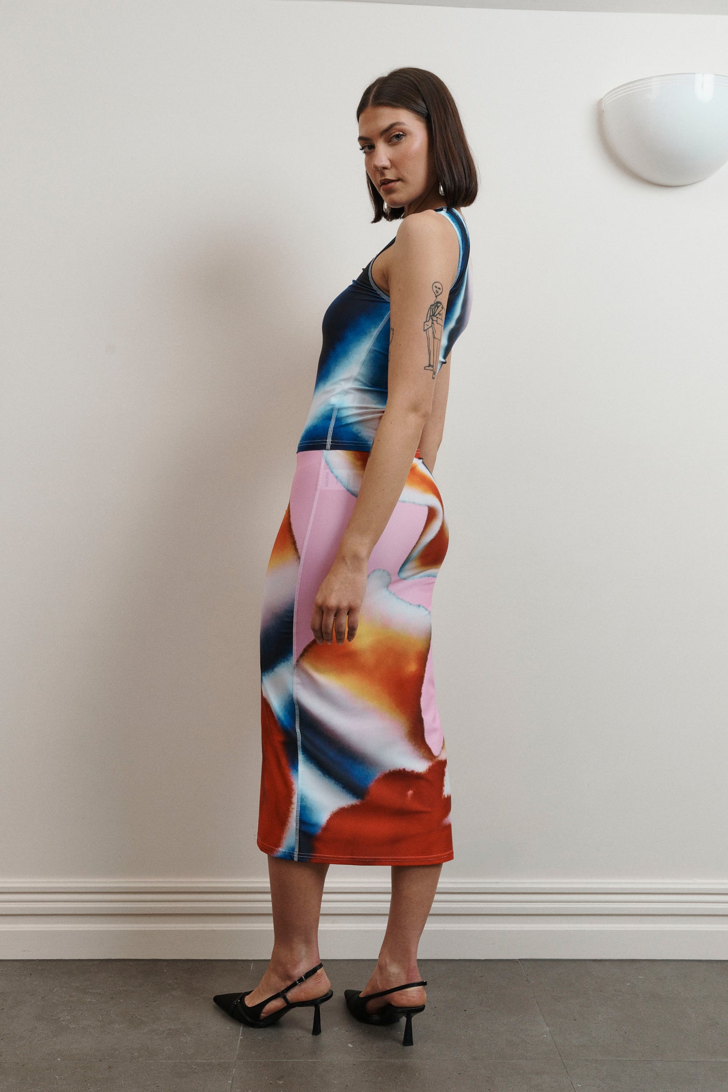 UMA KOURH tritonia skirt calypso multi coloured print red blue pink white abstract midi stretchy fitted skirt